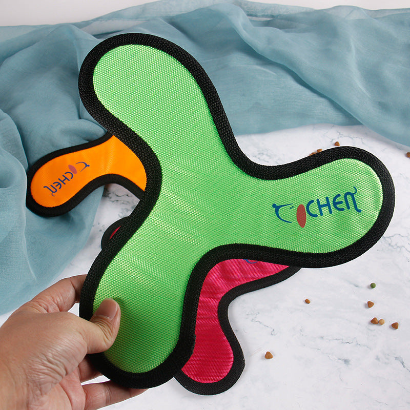 Tochen pet training tool in green, orange, and pink colors, designed for interactive play.