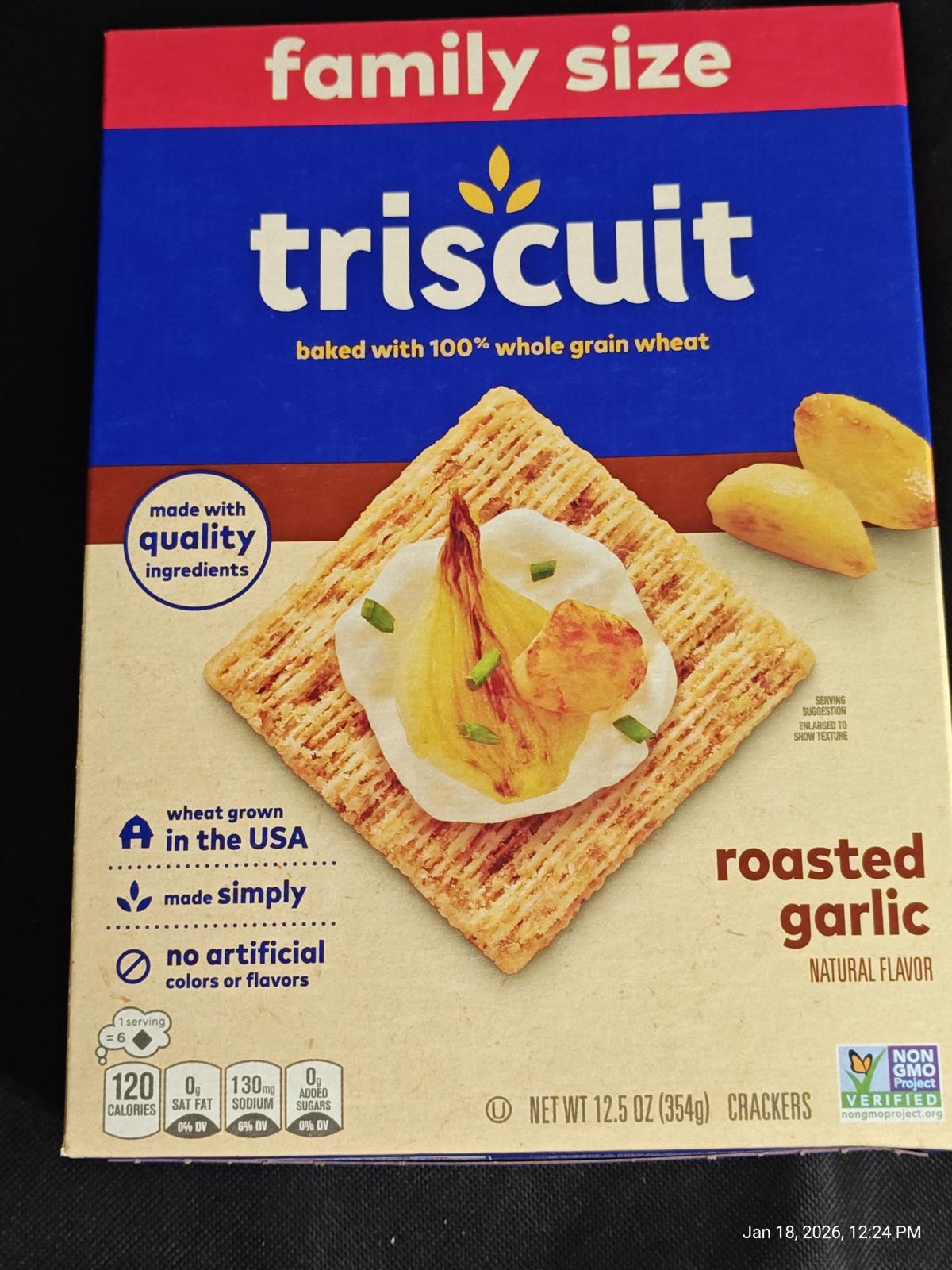Triscuit roasted garlic crackers in family size packaging with a crispy texture and natural flavor.