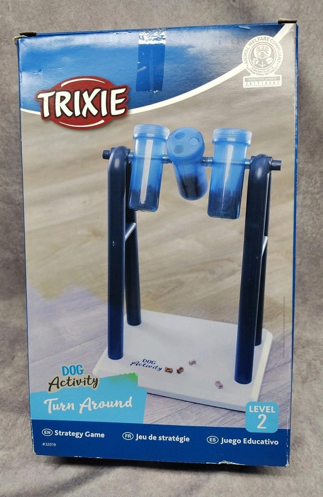 Trixie Dog Activity Turn Around game for dogs, featuring blue containers and a sturdy base.