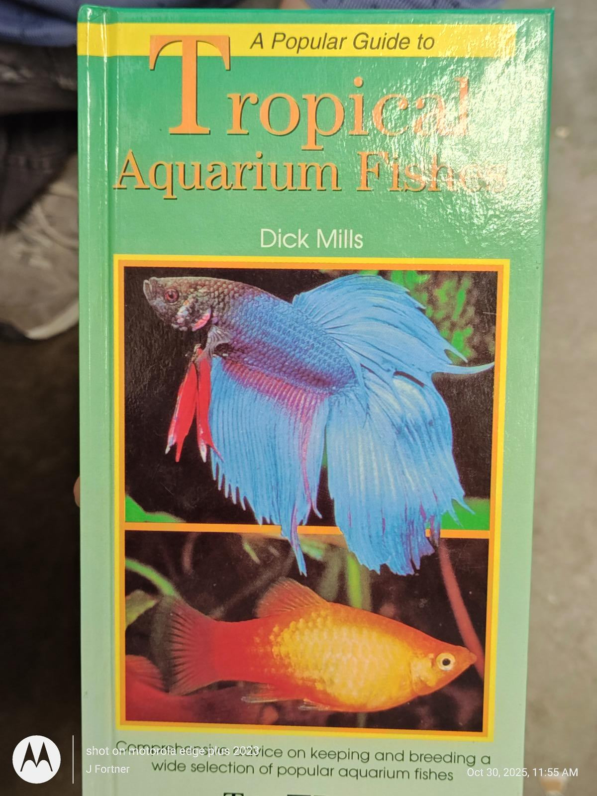 Tropical Aquarium Fish book cover featuring colorful fish illustrations and informative text.