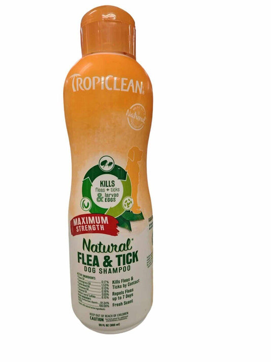 TropiClean Natural Flea & Tick Dog Shampoo in an orange bottle, designed for maximum strength against pests.