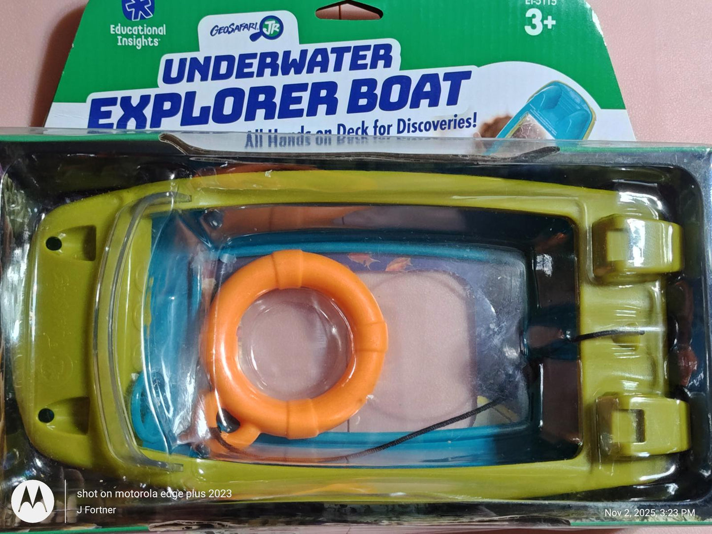 Underwater Explorer Boat with bright green and blue colors, featuring a life ring for aquatic adventures.