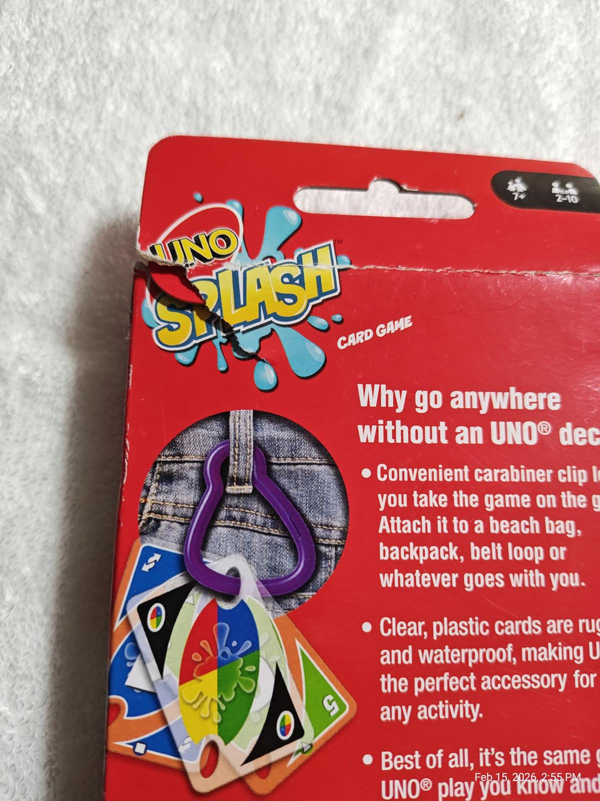 UNO Splash card game packaging featuring a carabiner clip for easy attachment.