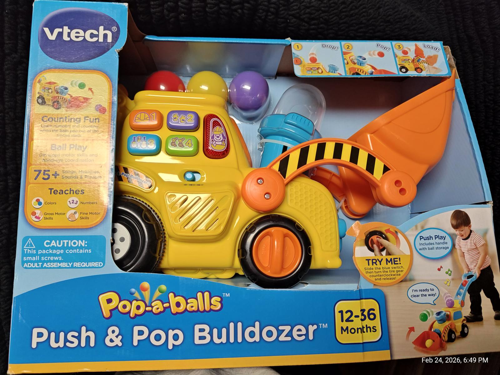 VTech Push & Pop Bulldozer toy with colorful balls and interactive features for toddlers.