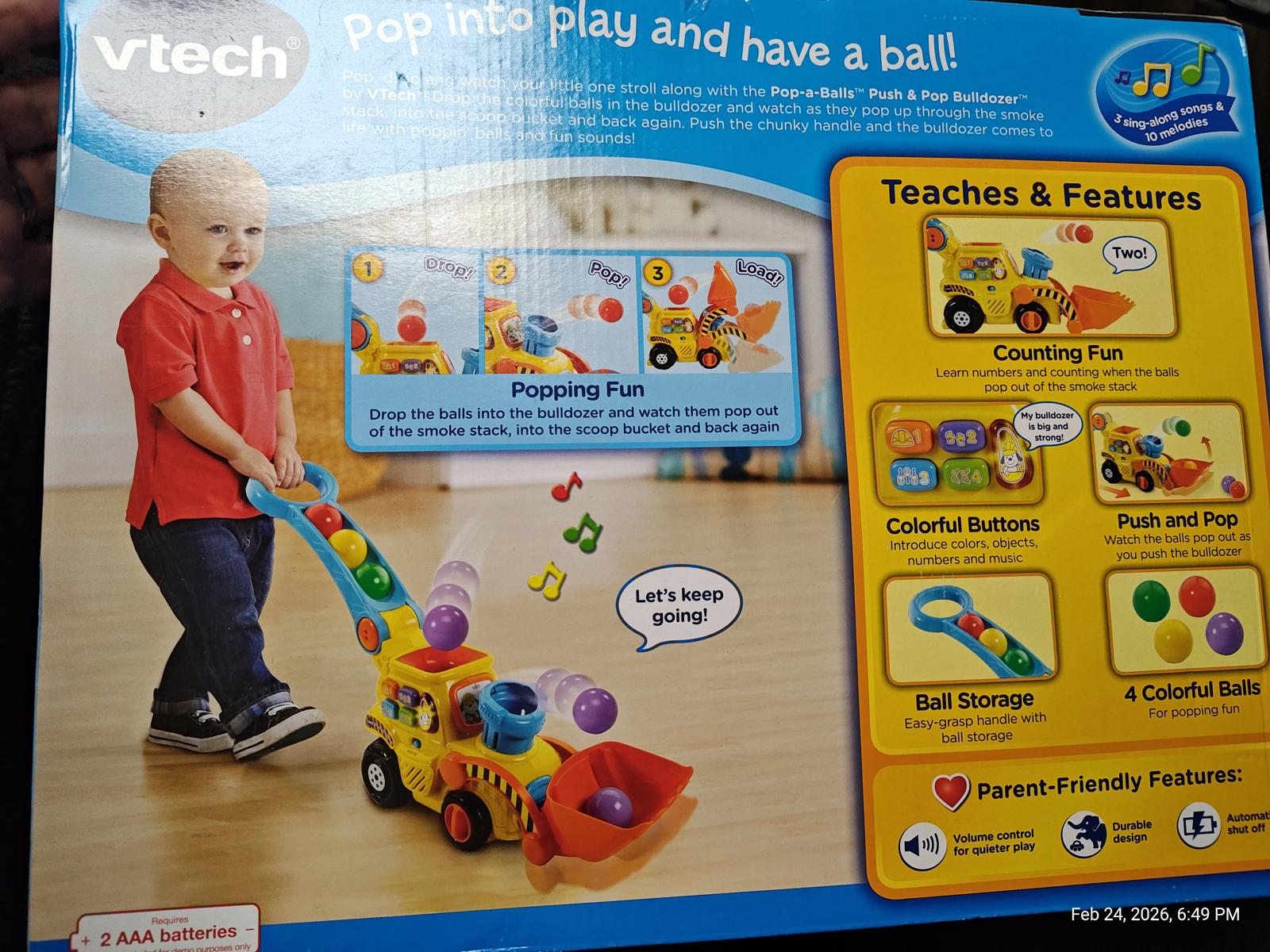 VTech Pop and Play toy truck with colorful balls and features for counting fun.