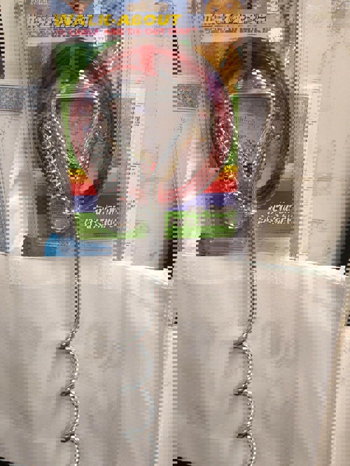 Walk About 15' cable and tie-out stake for pet safety, featuring a sturdy metal design.