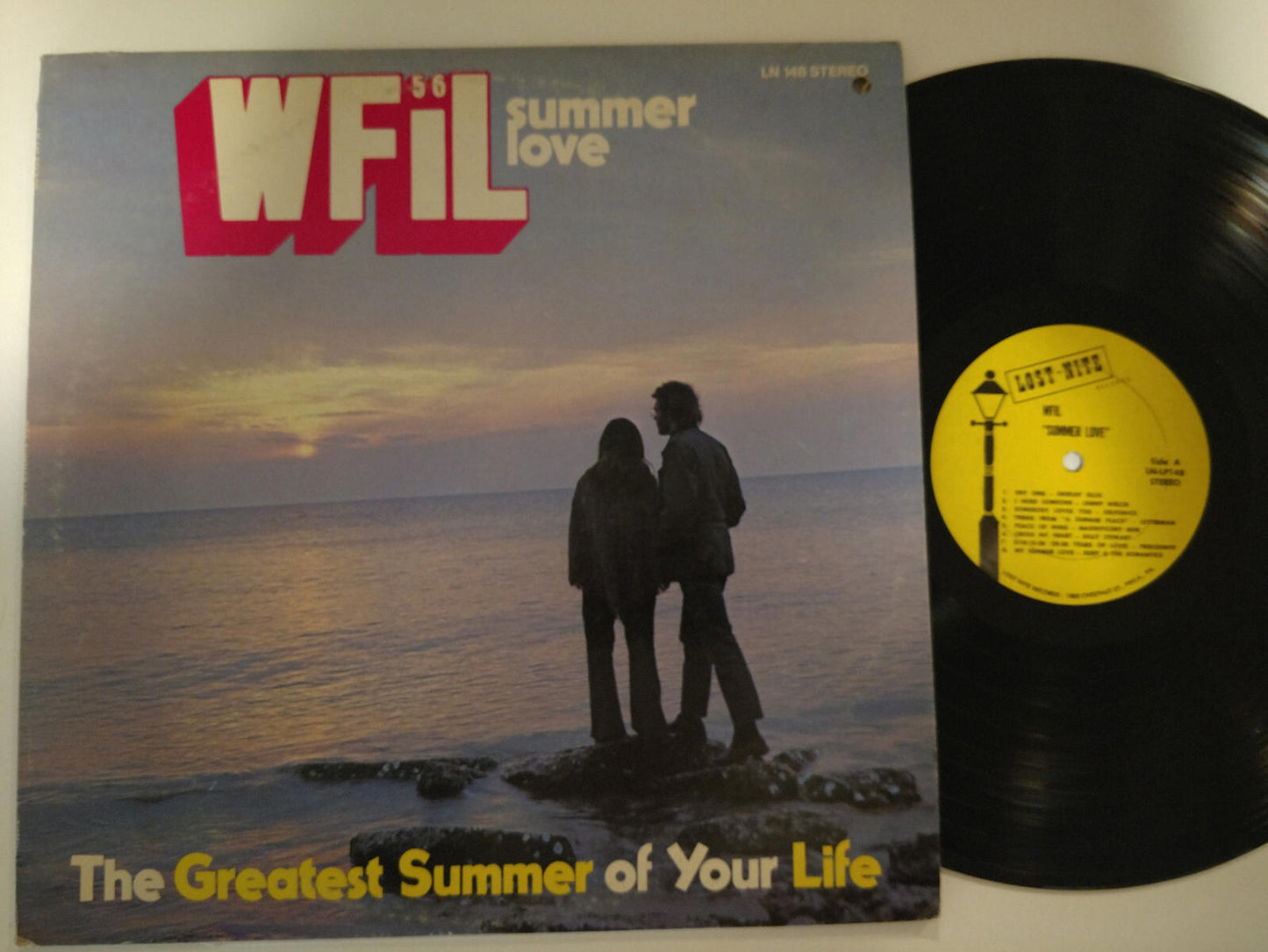 WFIL Summer Love vinyl record featuring a sunset and couple silhouette.