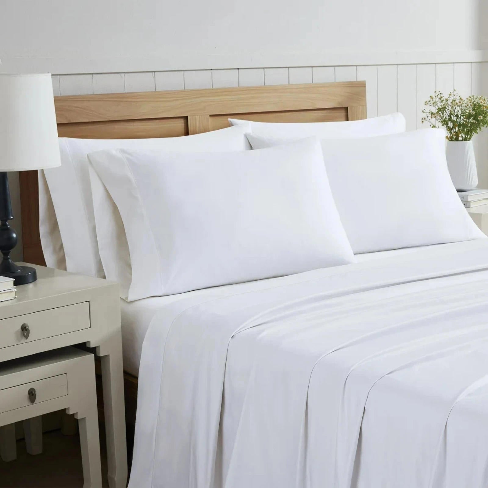 White Bed Sheets Set featuring soft fabric and elegant design for a cozy bedroom.