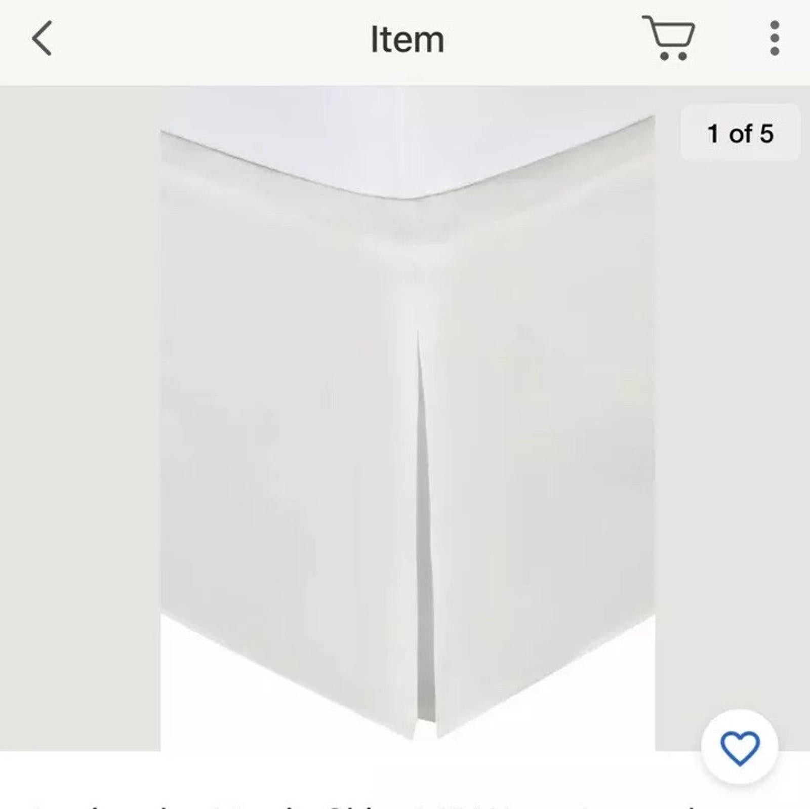 White bed skirt with pleated design for a clean look.