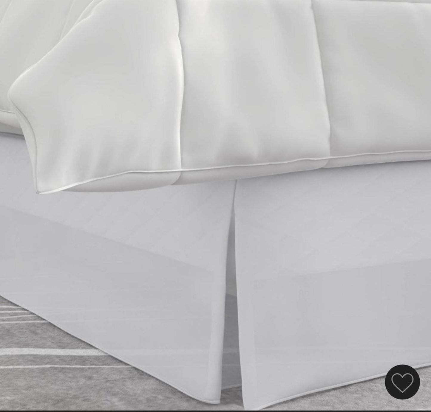 White quilted comforter set featuring a smooth finish and elegant design.