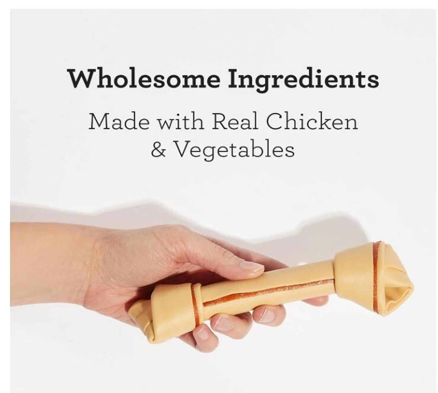 Wholesome Ingredients dog chew toy made with real chicken and vegetables, held in hand.