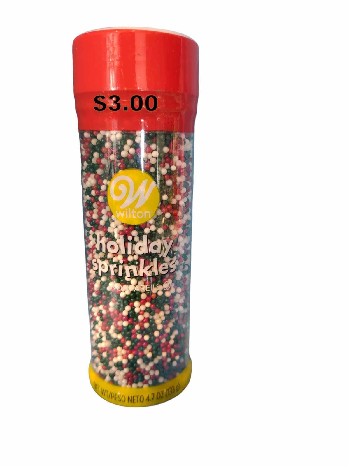 Wilton Holiday Sprinkles in a clear container with red and green colors for festive baking.