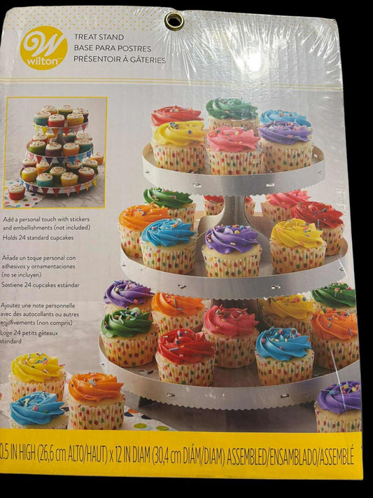 Wilton treat stand displaying colorful cupcakes with vibrant frosting and decorative wrappers.