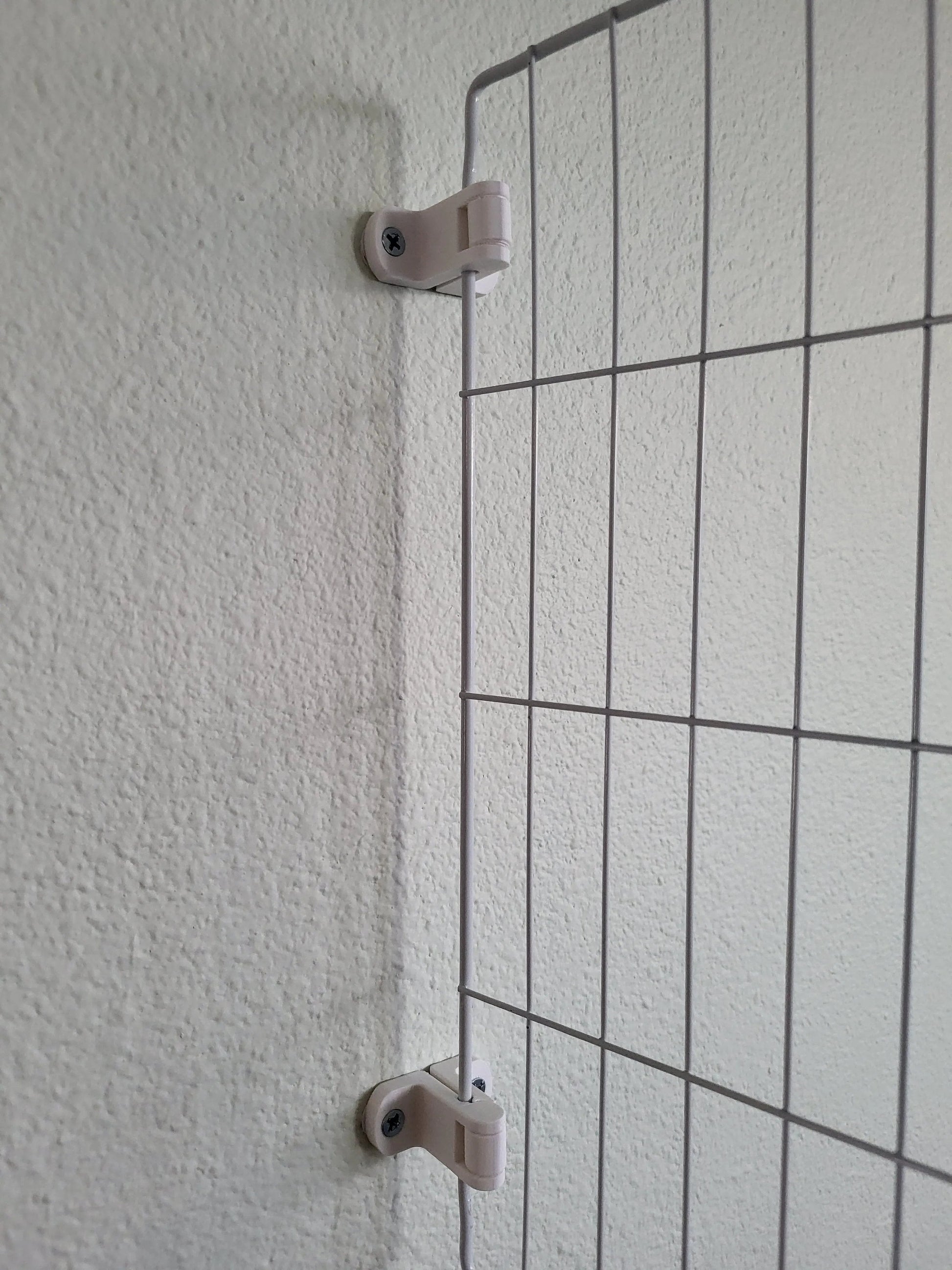 Wire grid panel connectors for wall-mounted organization.