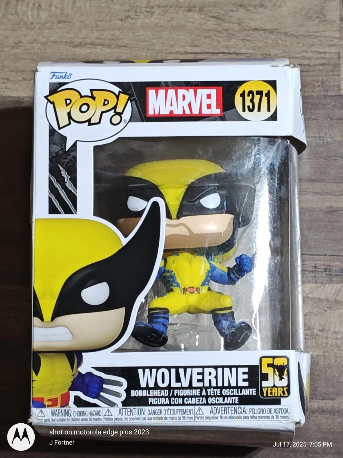 Wolverine Funko Pop figure in yellow and blue costume, celebrating 50 years of Marvel.