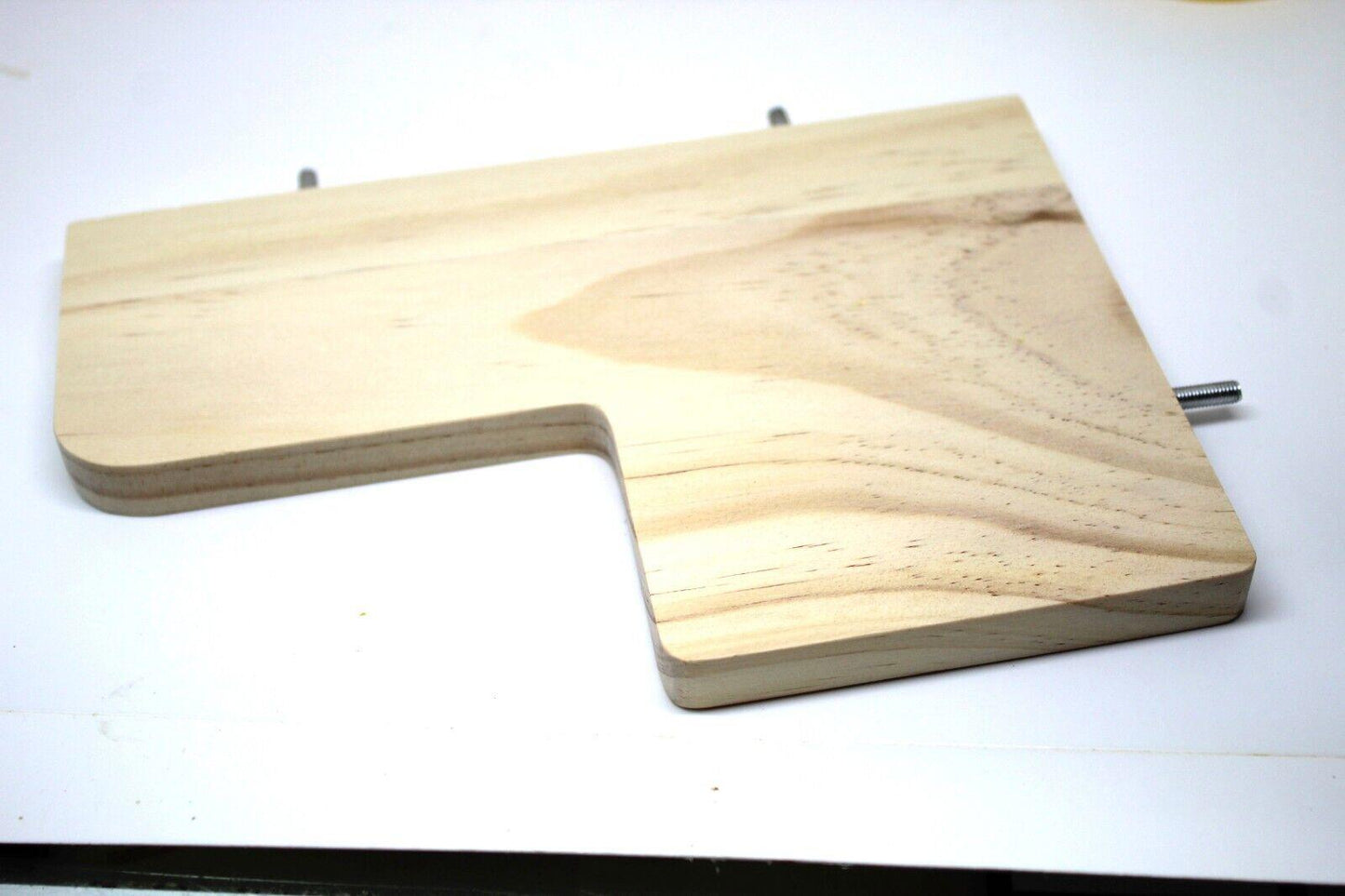 Wooden cutting board with a unique shape and smooth finish.