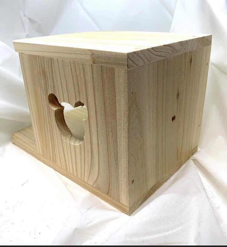 Wooden storage box with a heart-shaped cutout, perfect for organizing items.