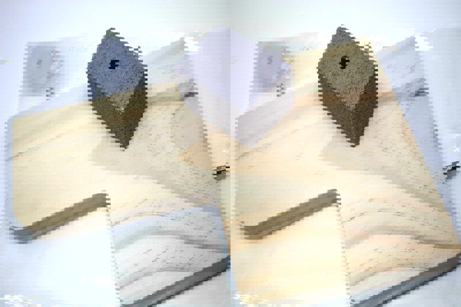 Woodworking clamp base with a gray foam block for stability.