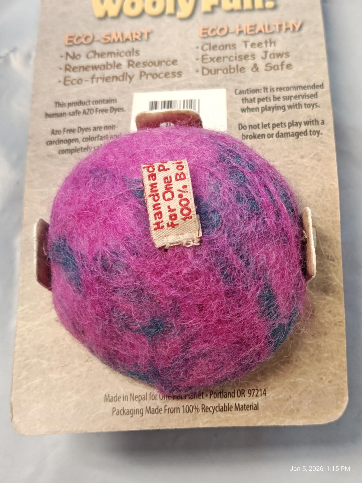 Wooly Ball eco-friendly pet toy in pink and purple colors, made from 100% recyclable materials.