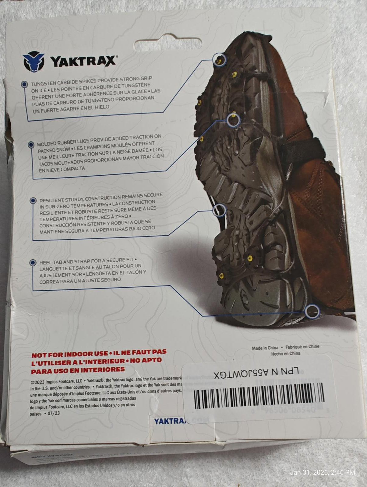 Yaktrax traction cleats designed for outdoor use, featuring durable rubber and metal spikes for enhanced grip.