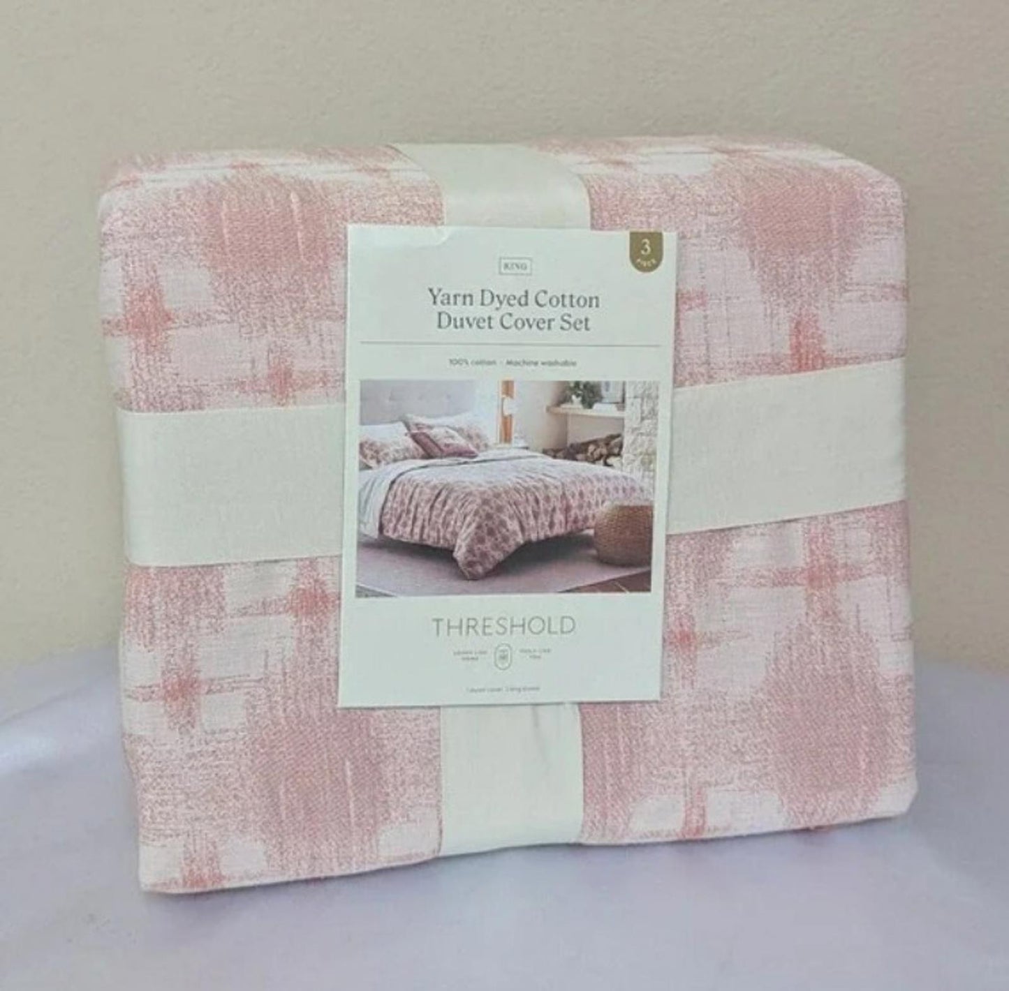 Yarn Dyed Cotton Duvet Cover Set in soft pink with a textured pattern.