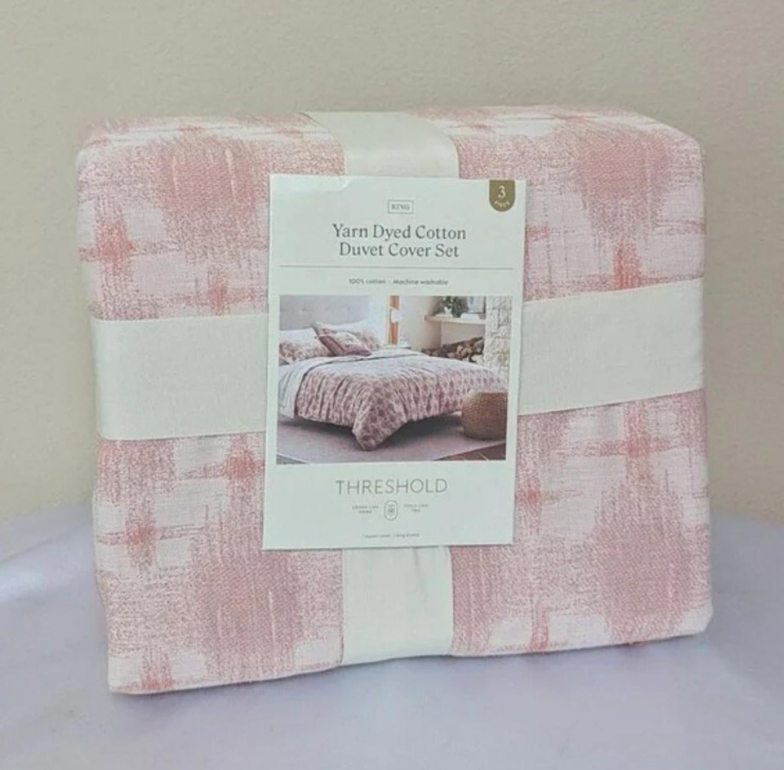 Yarn Dyed Cotton Duvet Cover Set in soft pink with a textured pattern.