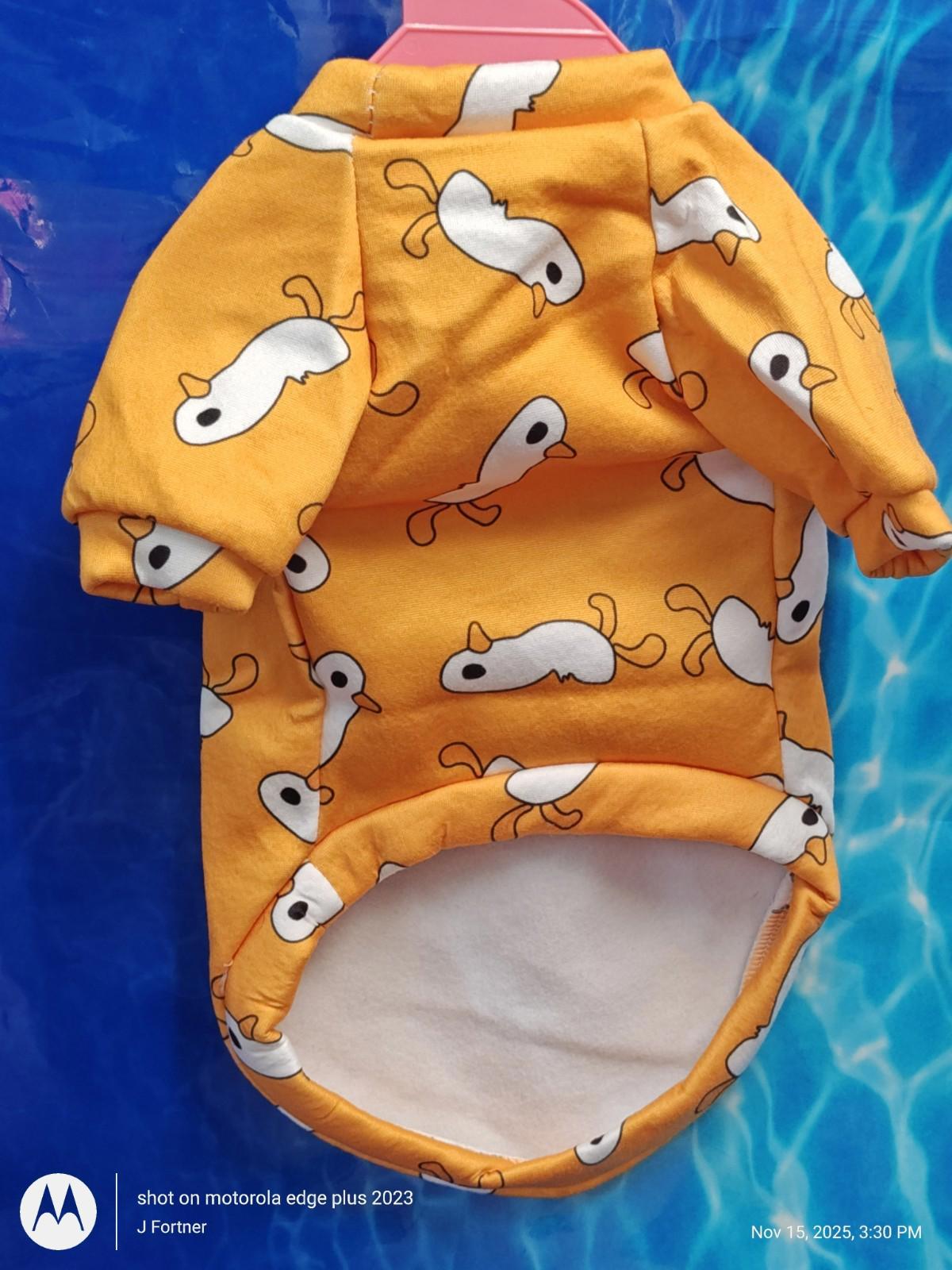 Yellow Dog Shirt featuring cute white cartoon fish patterns, perfect for playful pets.