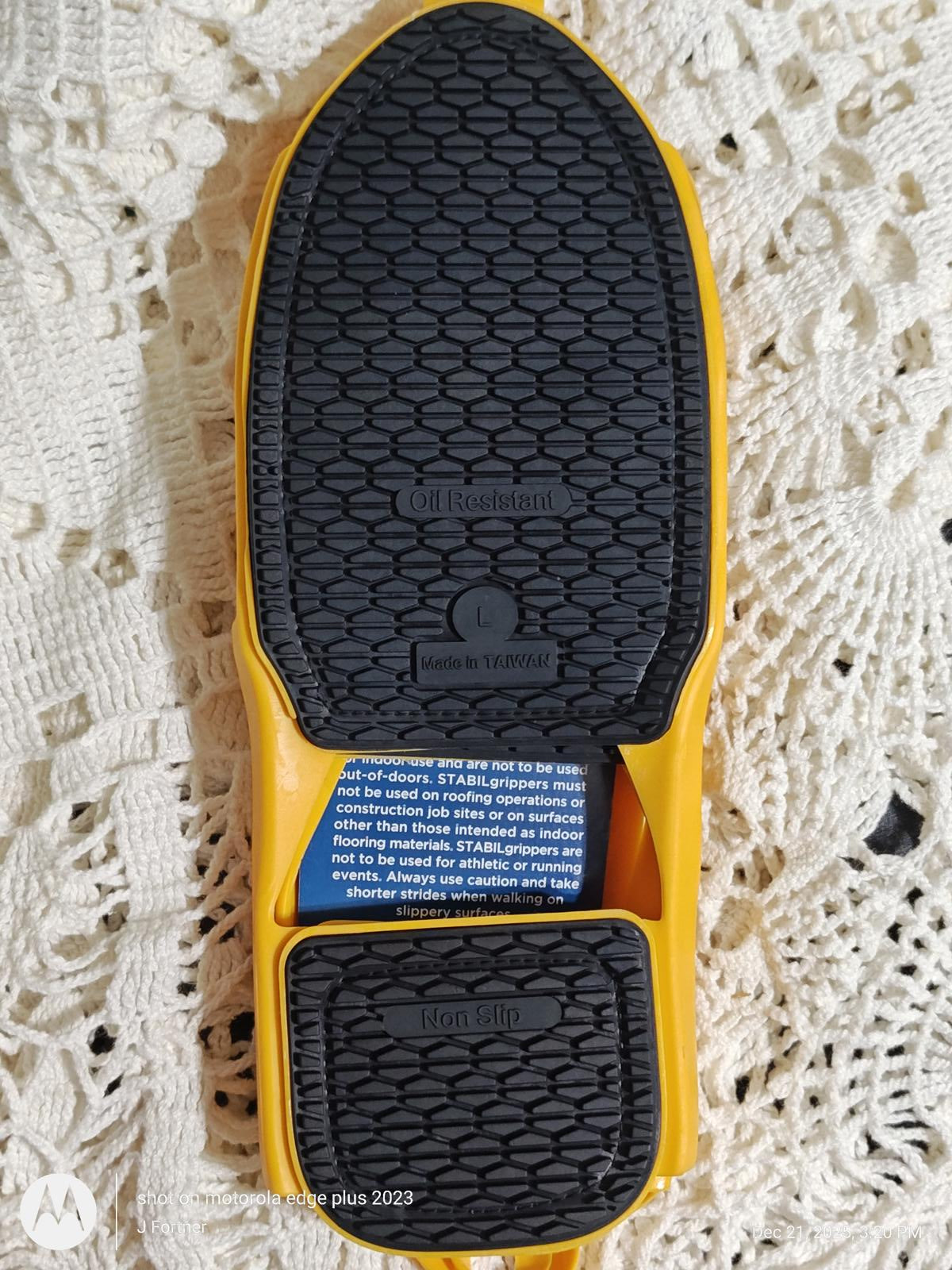 Yellow flip-flop sole with textured grip for comfort and stability.
