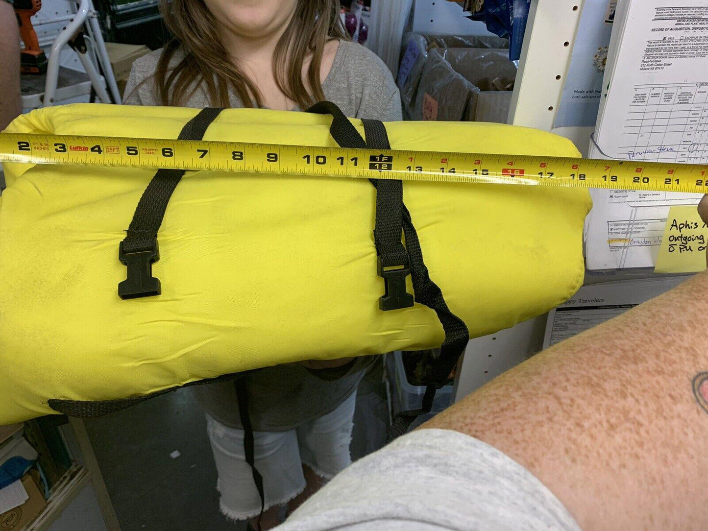 Yellow waterproof duffel bag with black straps, measuring 30 inches in length.