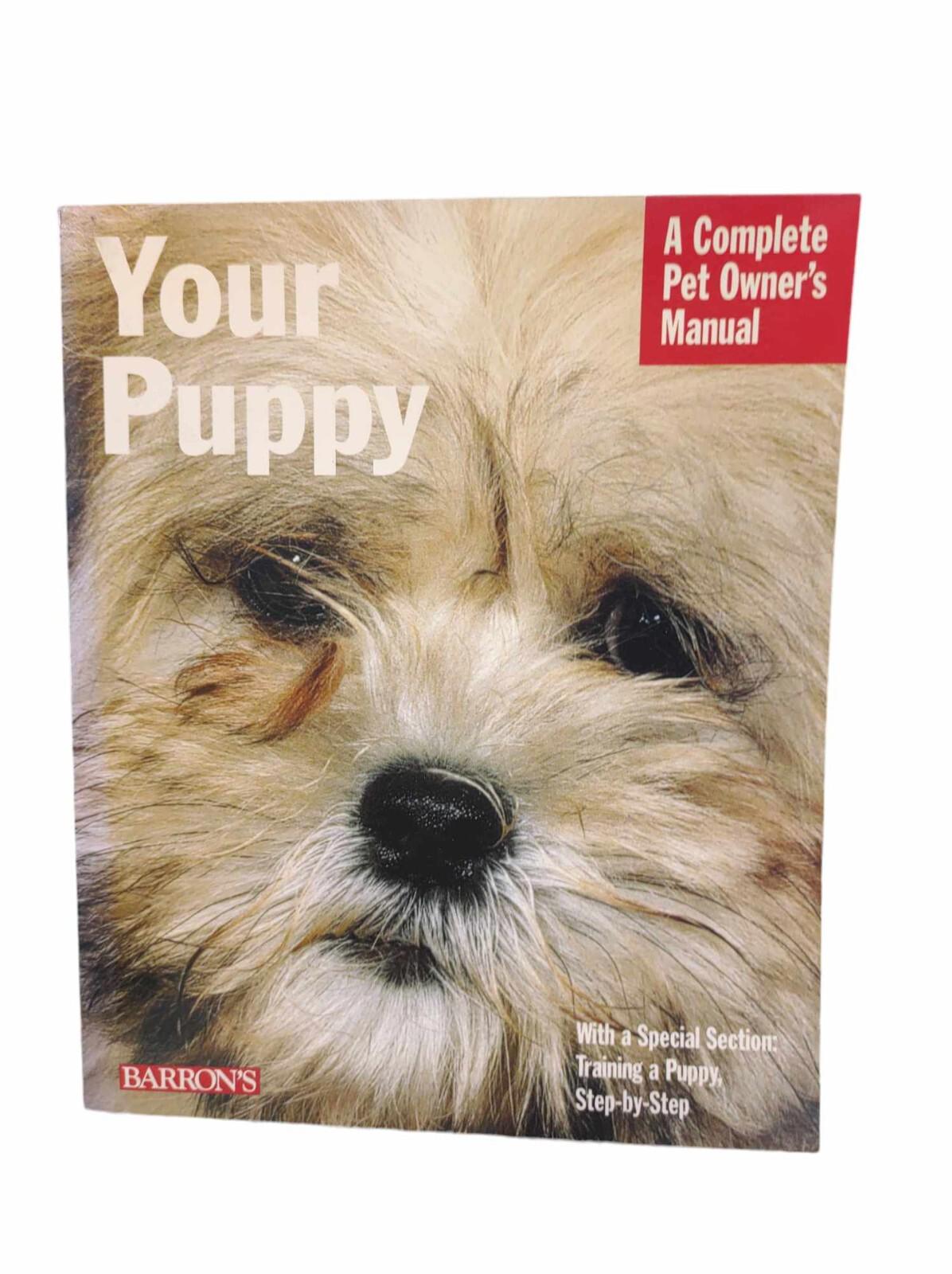 Your Puppy book cover featuring a close-up of a fluffy dog, ideal for new pet owners.