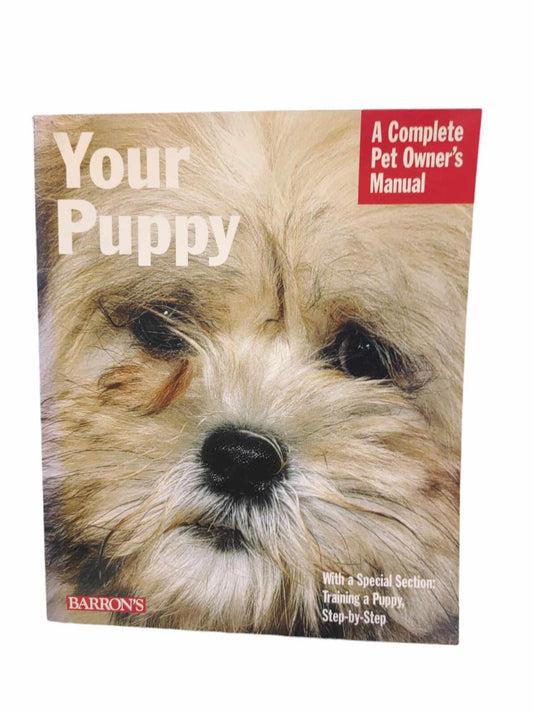 Your Puppy book cover featuring a close-up of a fluffy dog, ideal for new pet owners.