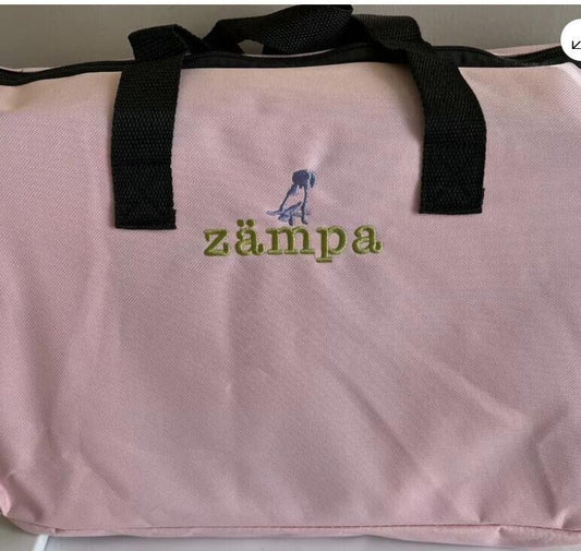 Zampa pink tote bag with black handles and embroidered logo.