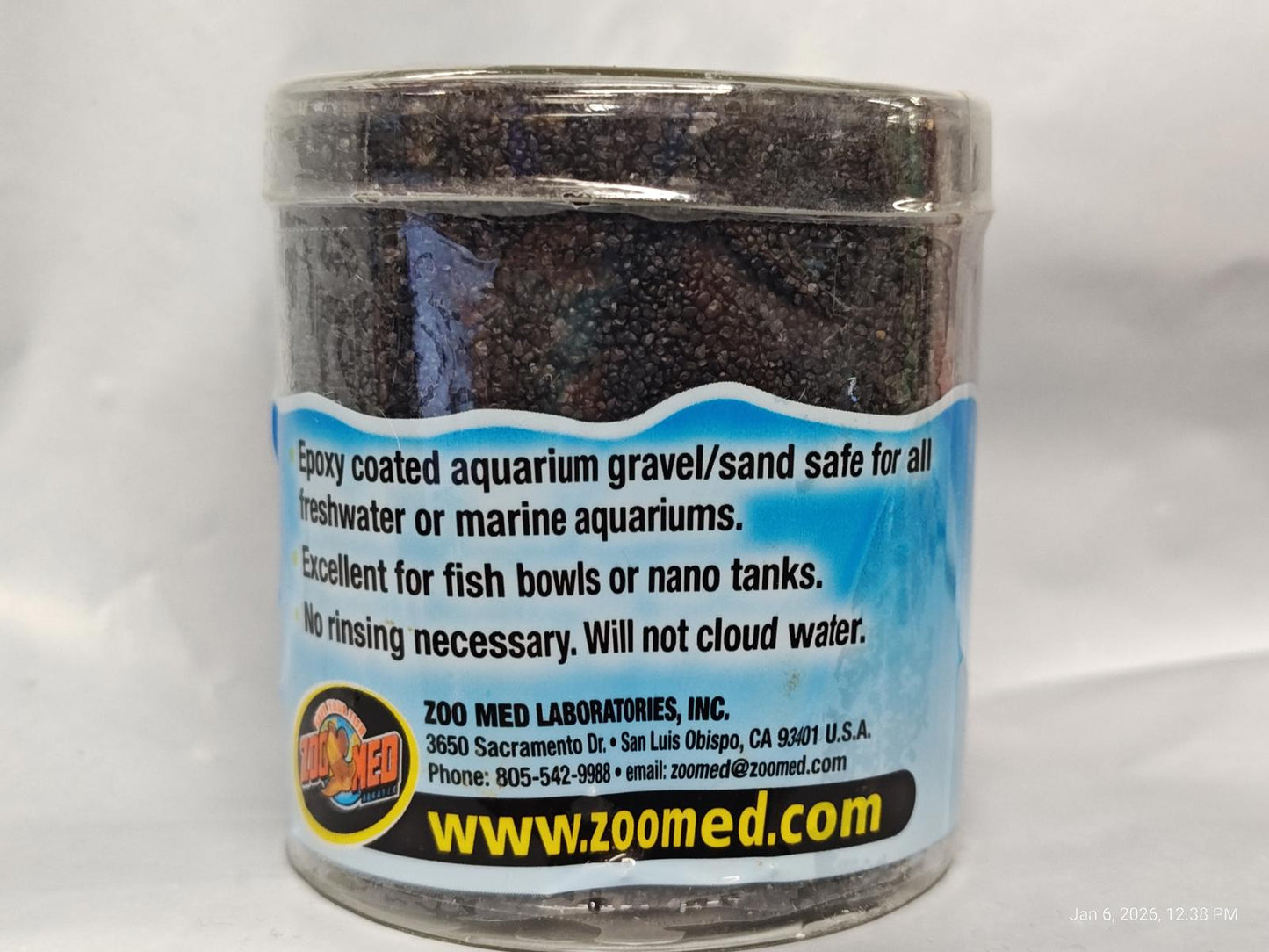 Zoo Med aquarium gravel in a clear container, suitable for freshwater and marine aquariums.